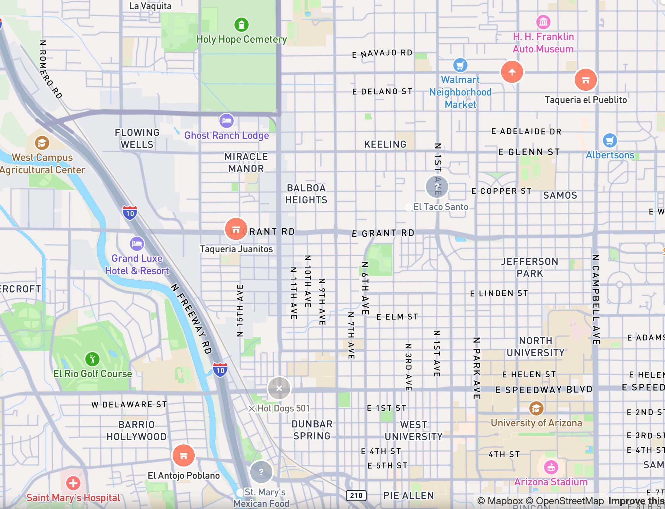 North-central Tucson on CartoTaco: coral markers for vetted spots, a grey cross for Hot Dogs 501, which has closed, and grey question marks for spots still being scouted